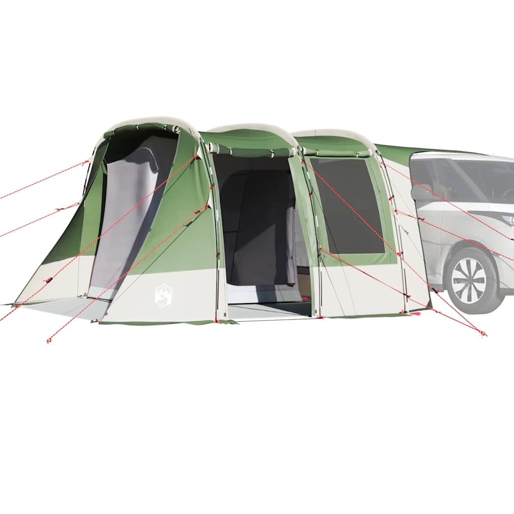 Grønt vandtæt fortelt monteret på en bil under camping