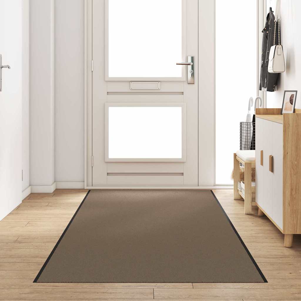 Beige og sort dørmåtte i 120x400 cm liggende i en gang